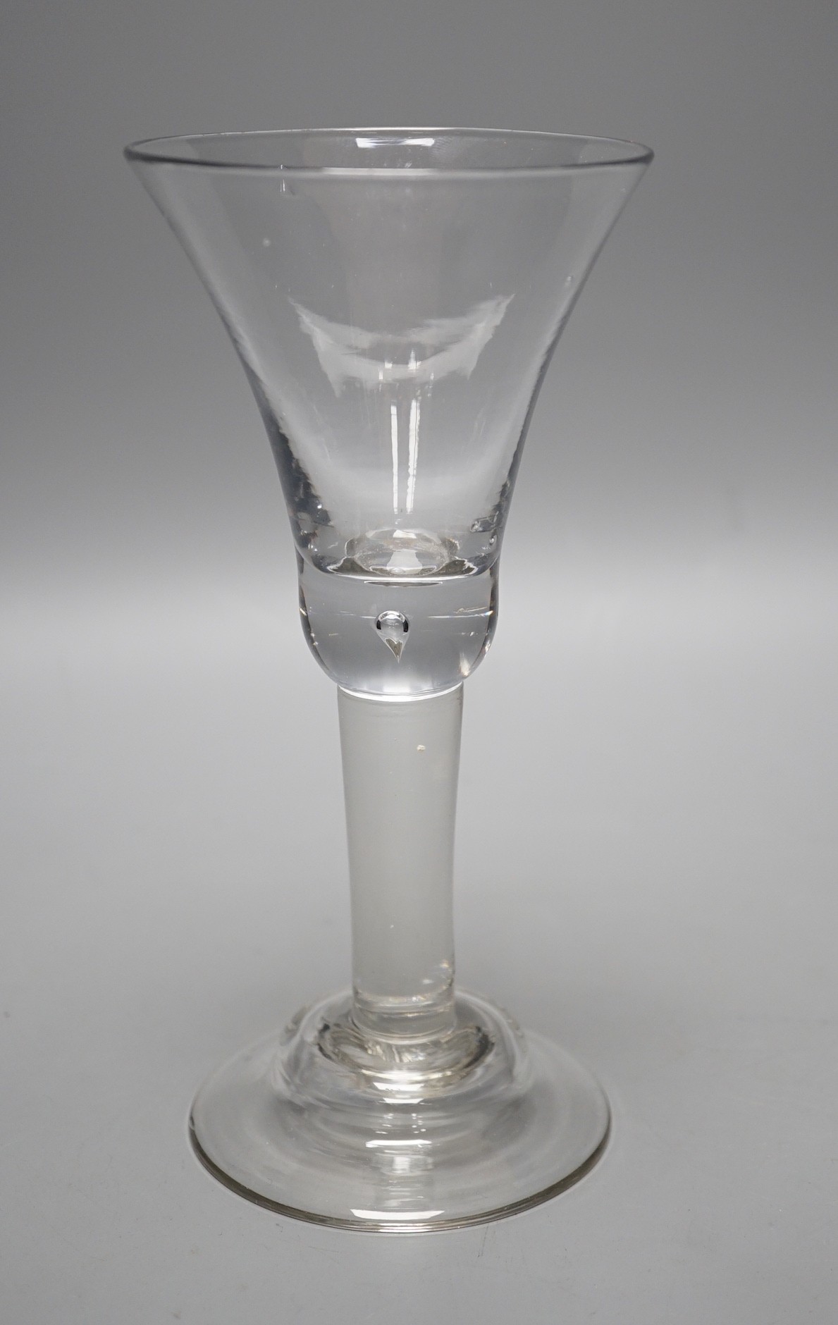 A George II glass goblet, domed foot, 19cm tall